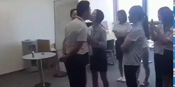 Female workers forced to line up and kiss their boss