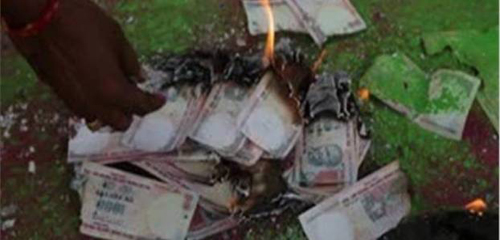 Black money holders burn currency notes in UP