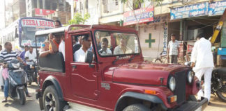 Harish in an open top Jeep